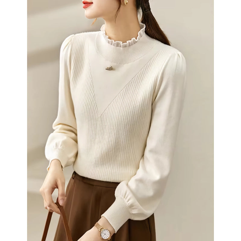 Eleganter Strickpullover mit Puffärmeln und Love-Brosche