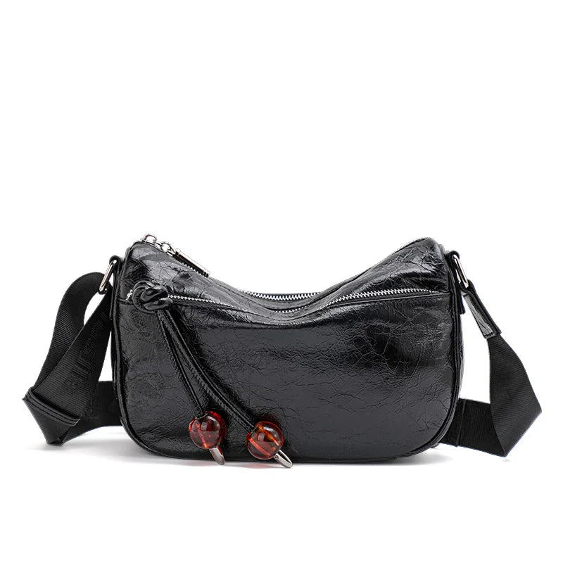 Bolso bandolera de piel suave con textura plisada y elegante para mujer