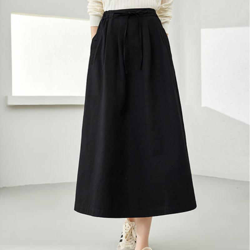 Falda midi elegante de algodón negra con bolsillos