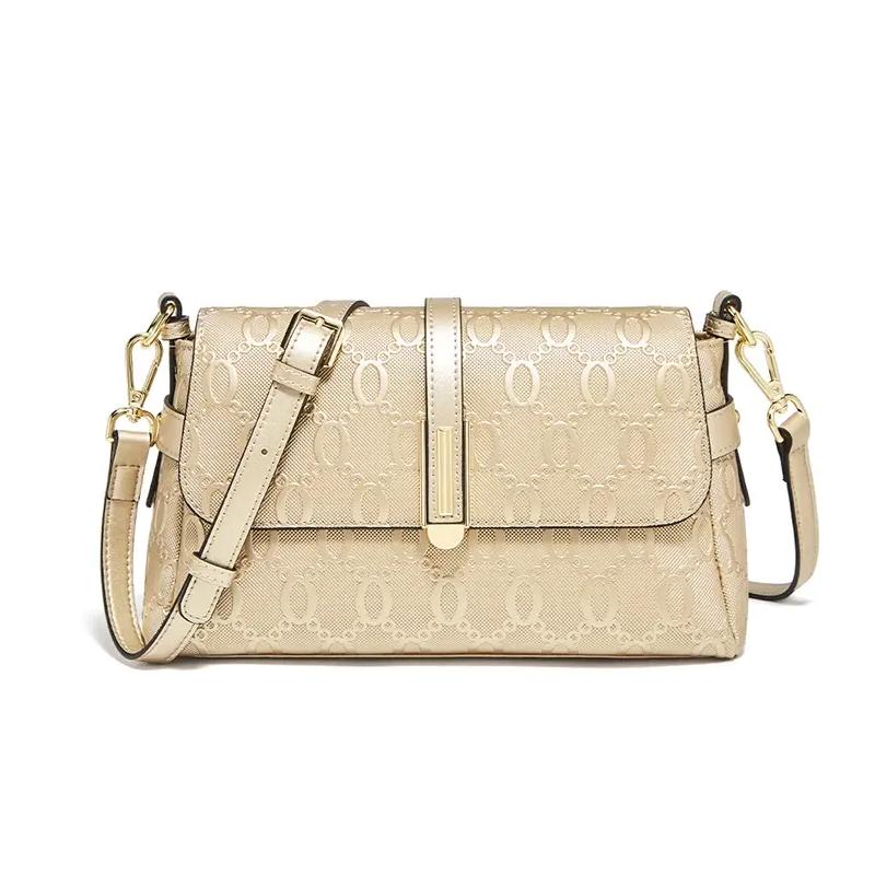 Elegante bolso bandolera y de hombro dorado