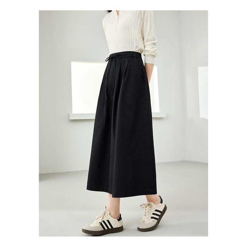 Falda midi elegante de algodón negra con bolsillos