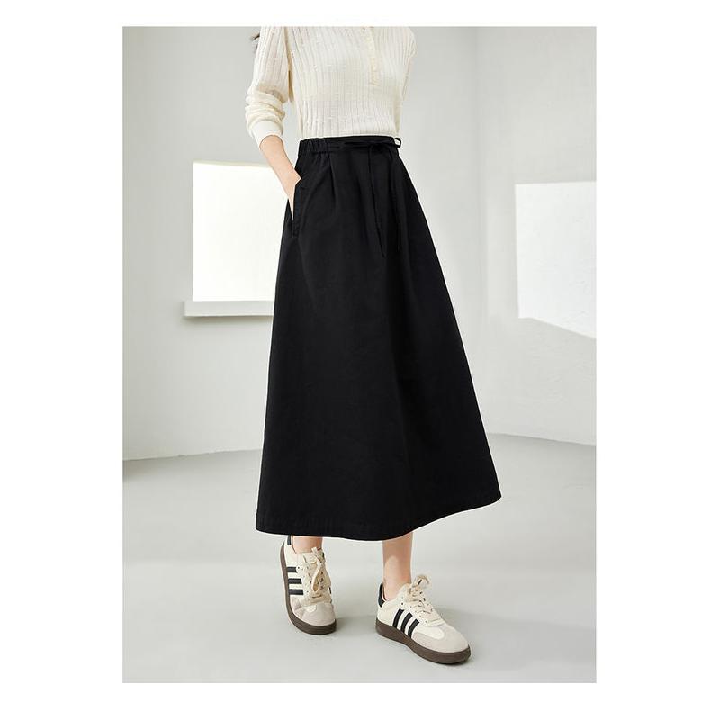 Falda midi elegante de algodón negra con bolsillos