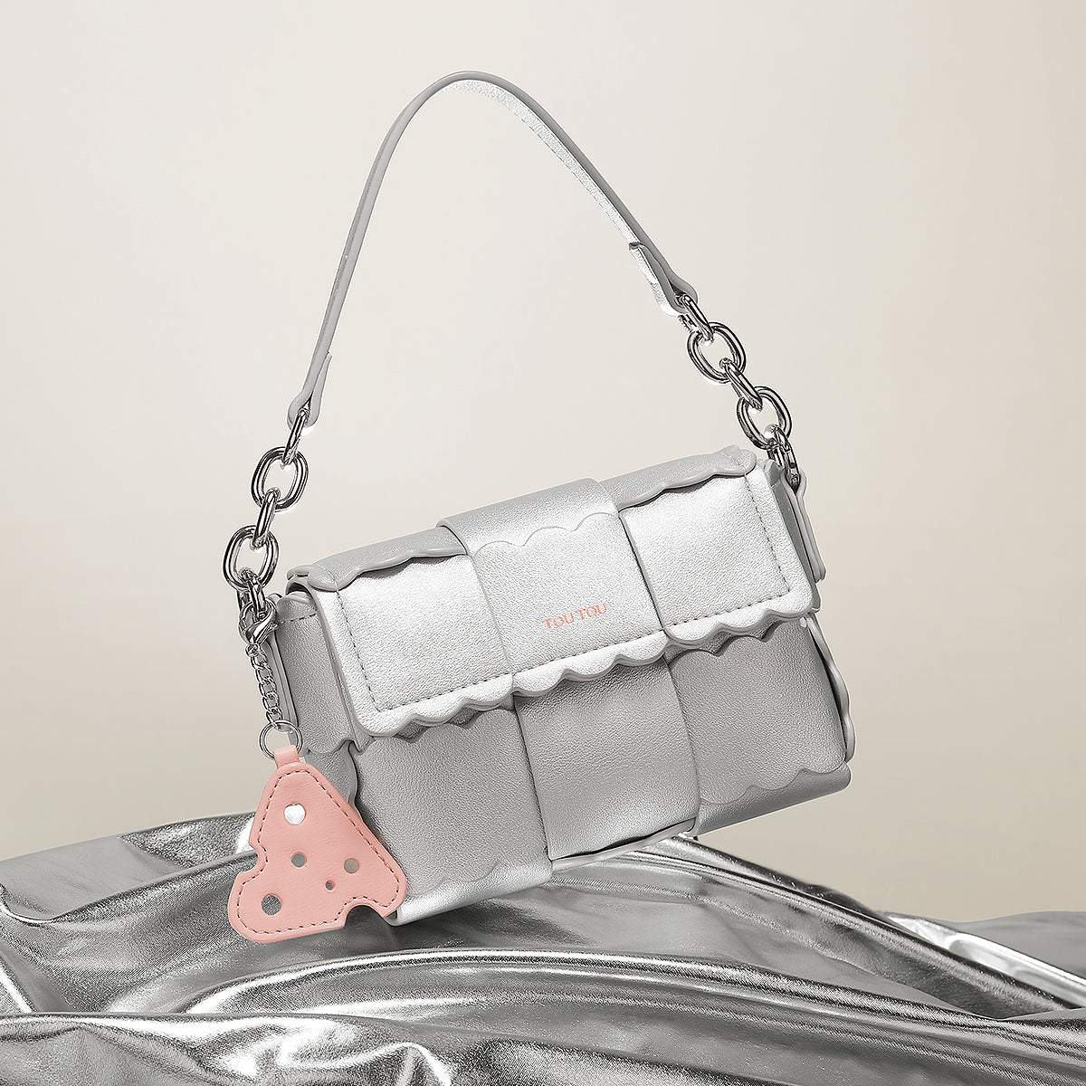 Elegante gewebte Kissenhandtasche