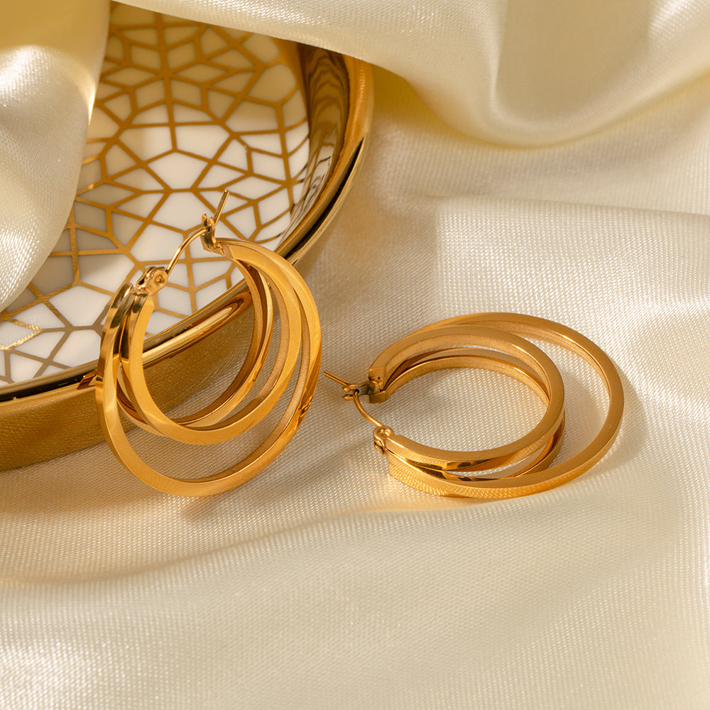 Pendientes de acero inoxidable con doble espiral bañados en oro de 18 quilates