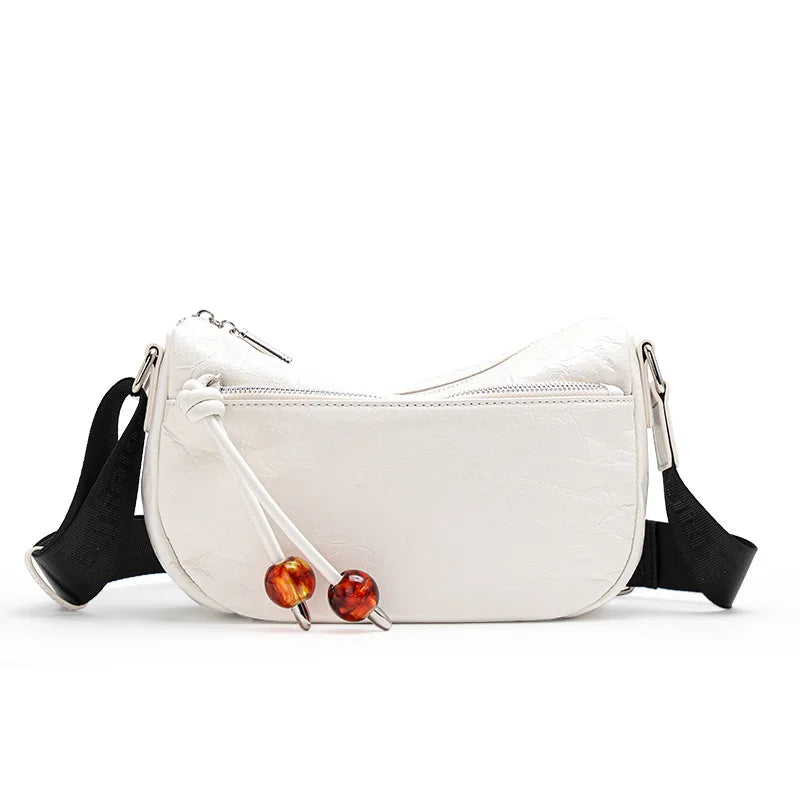Bolso bandolera de piel suave con textura plisada y elegante para mujer