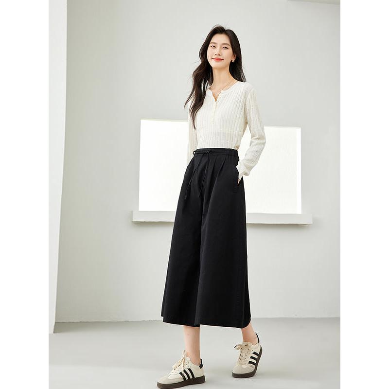 Falda midi elegante de algodón negra con bolsillos