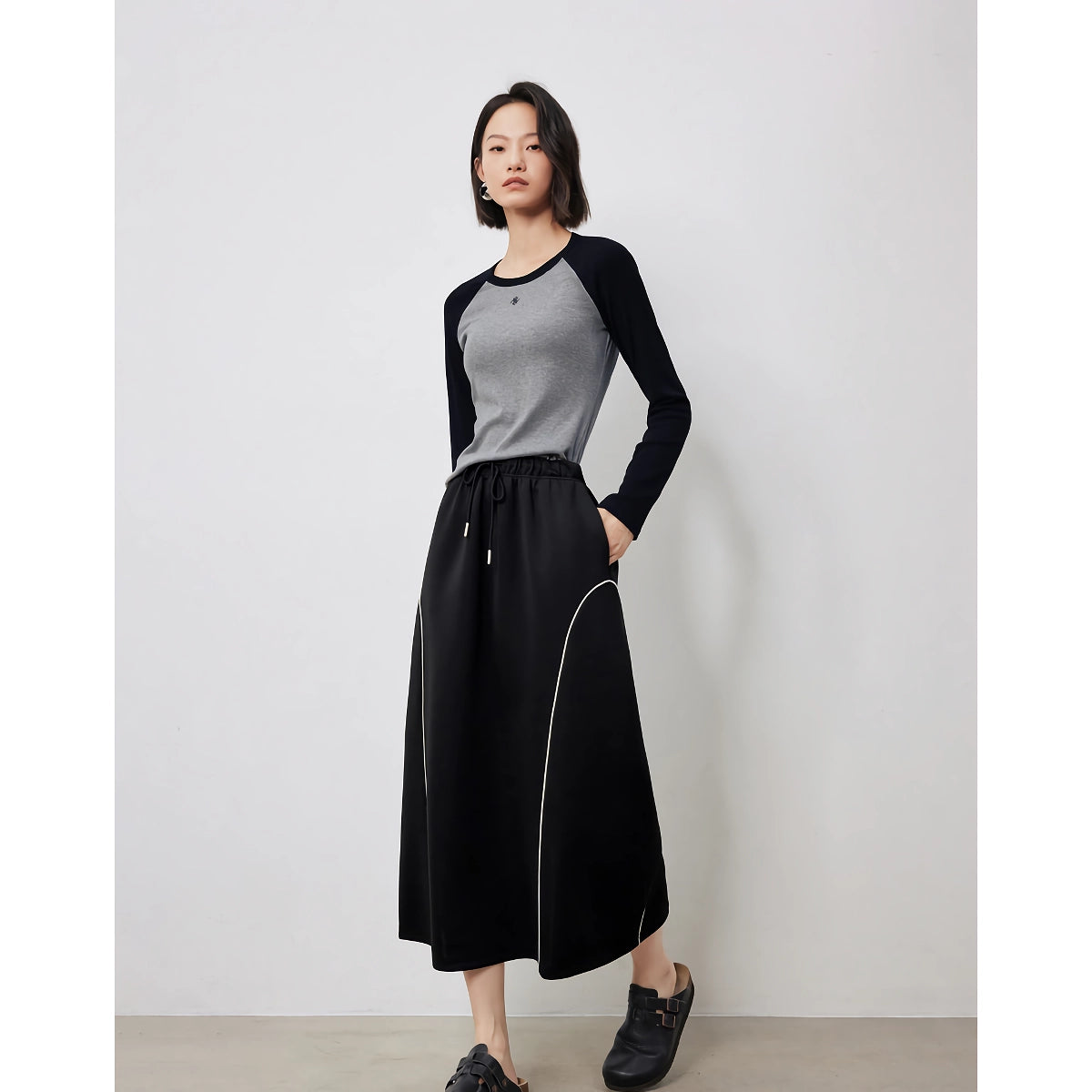 Falda elegante de otoño de longitud media en forma de A con cintura elástica