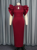 Vestido de cuello alto con aberturas color rojo vino