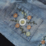 Sommerliche Jeansshorts mit Blumenstickerei, hoher Taille und weitem Bein