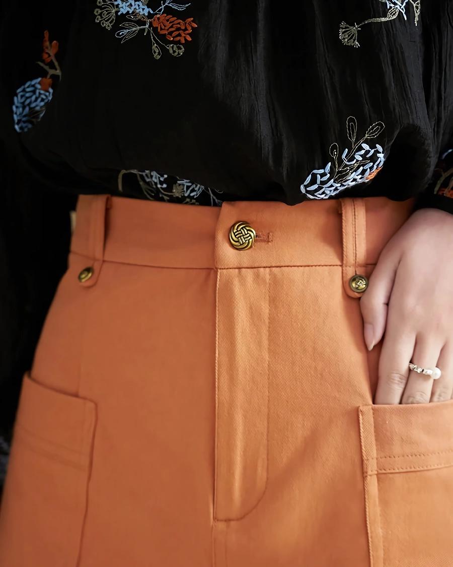 Frühlingsorangefarbener A-Linien-Rock mit hoher Taille und symmetrischen Taschen