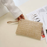 Modische, gewebte Clutch im Bohemian-Stil mit Handgelenksriemen