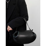 Elegante runde Handtasche aus veganem Leder