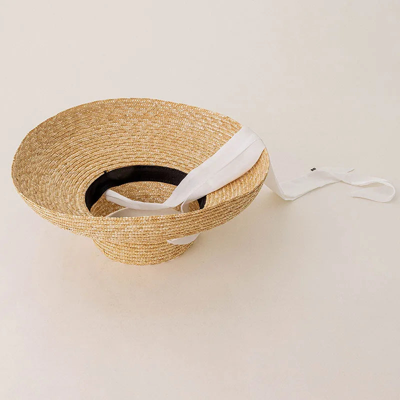 Elegante sombrero de paja de playa de verano de ala ancha