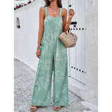 Eleganter Jumpsuit mit weitem Bein, geometrischem Print und Hosenträgern