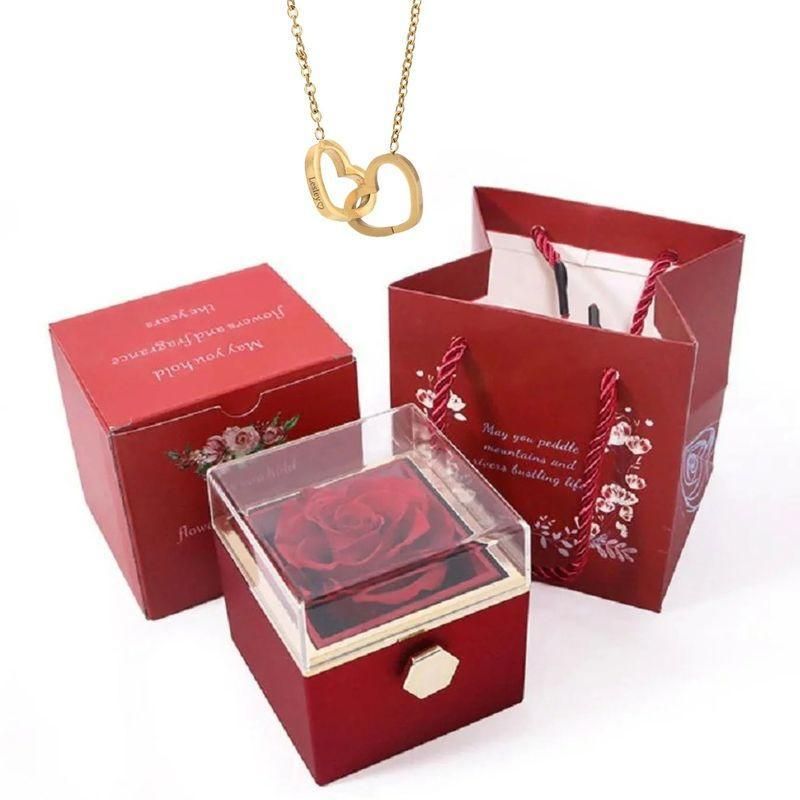 Elegante caja de acero inoxidable con forma de rosa giratoria y collar con corazón grabado