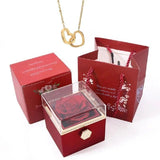 Elegante caja de acero inoxidable con forma de rosa giratoria y collar con corazón grabado