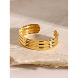 Pulsera tubular brillante de triple capa bañada en oro de 18 quilates