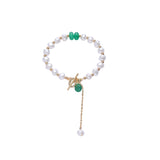 Elegante pulsera con dijes de perlas irregulares