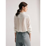 Elegante blusa blanca elegante de oficina de seda de morera