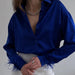 Elegante Bluse mit Federmanschetten