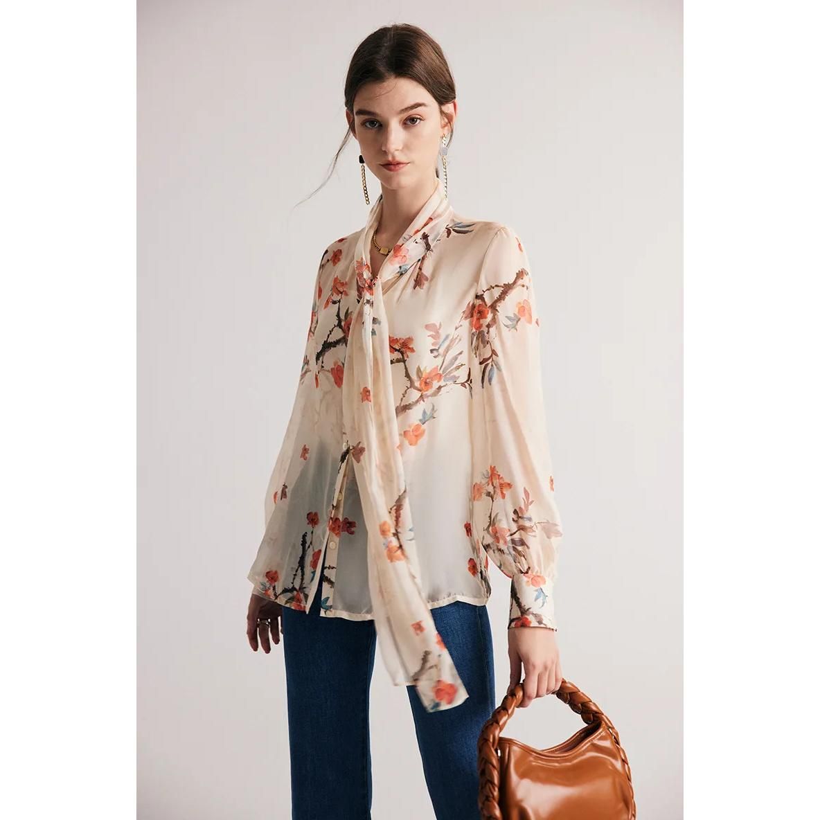 Blusa elegante con cuello de lazo en mezcla de seda floral