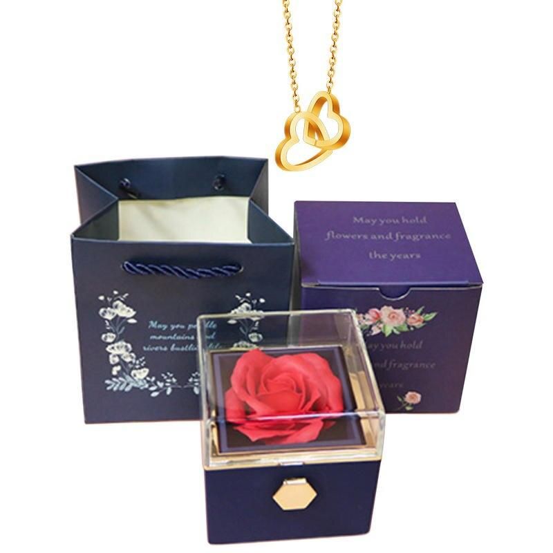 Elegante caja de acero inoxidable con forma de rosa giratoria y collar con corazón grabado