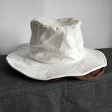 Sombrero de pescador blanco de ala ancha para el sol: protección elegante para exteriores