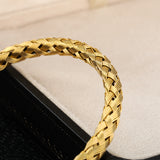 Gewebtes Charm-Armband aus Edelstahl und Gold