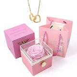 Elegante caja de acero inoxidable con forma de rosa giratoria y collar con corazón grabado