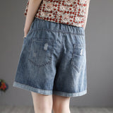 Sommerliche Jeansshorts mit Blumenstickerei, hoher Taille und weitem Bein