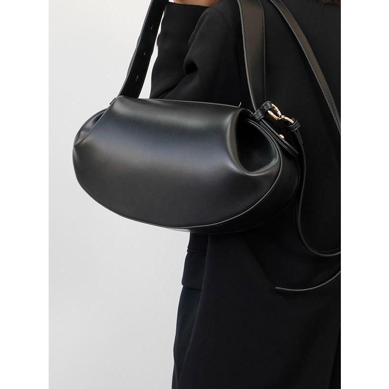 Bolso de mano elegante redondo de piel vegana