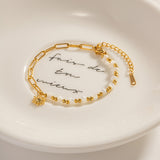 Elegante pulsera de cuentas con colgante de sol de acero inoxidable para mujer