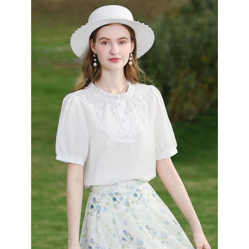 Blusa de moda con mangas abullonadas de encaje blanco de verano